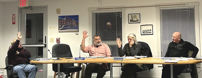 From left: Waldoboro Planning Board members John Kosnow, Brendan McGuirl, Barbara Boardman, and Eric Stark vote on a proposed subdivision of approximately 98 acres on Old Augusta Road. Stark voted against the subdivision, citing environmental and aesthetic concerns. (Molly Rains photo)