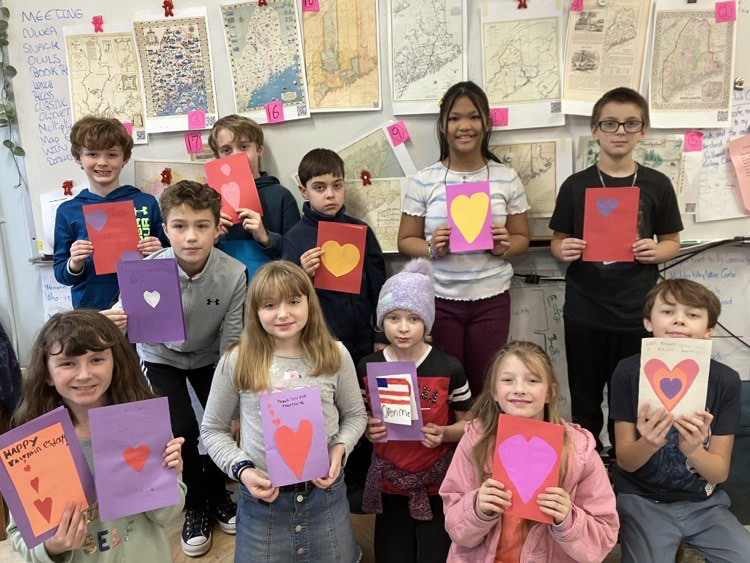 Mrs. Hallowells fourth grade class show off the Valentine's Day cards they made and sent off to American soldiers who have been deployed. (Photo courtesy Becky Hallowell)