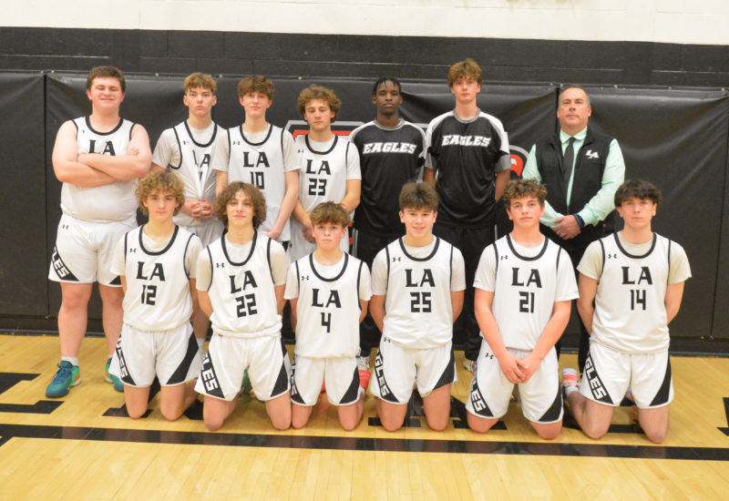 The Lincoln Academy JV boys basketball team finished the season undefeated. Front row, from left: Team members Jacob Hedrick, James Wyman-Benner, Paul Leeman, James Hanley, Joshua Ward, and Malachi Farrin. Back row, from left: Shawn McFarland, Chase Ober, Abe Guilford, Terry Welle, Otto Schoenthal, and coach Rand Maker. Not pictured: Michael Mitchell. (Paula Roberts photo)