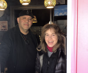 Chris Padil and Abby White stand in window of Koko's Sandwich Bar, their new lunch restaurant that opened in Damariscotta on Monday, March 25. Padil and White, owners of Ann's Book Bistro, purchased and renovated the former Gator's Deep South BBQ building in Damariscotta to house Koko's and offer simple everyday fare. (Elizabeth Walztoni photo)