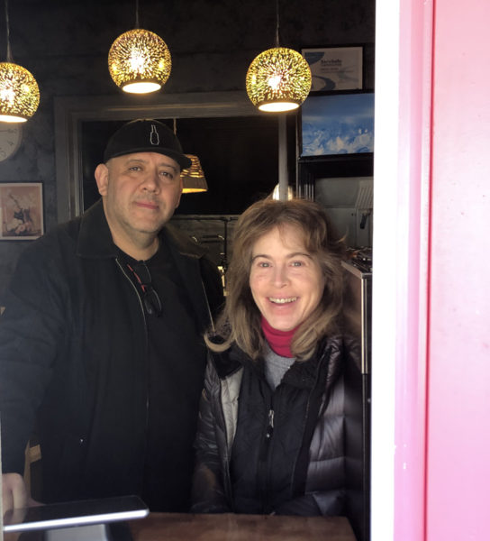 Chris Padil and Abby White stand in window of Koko's Sandwich Bar, their new lunch restaurant that opened in Damariscotta on Monday, March 25. Padil and White, owners of Ann's Book Bistro, purchased and renovated the former Gator's Deep South BBQ building in Damariscotta to house Koko's and offer simple everyday fare. (Elizabeth Walztoni photo)