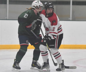 Remy LeBel (right) battles for position in front of the net for the Kents Hill Huskies. (Mic LeBel photo)