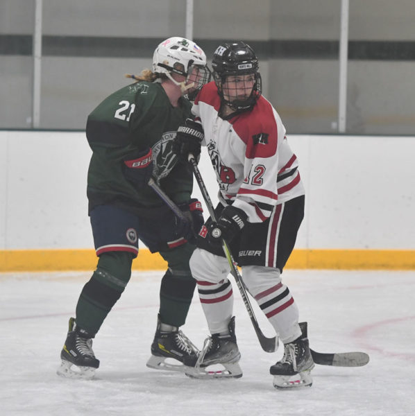 Remy LeBel (right) battles for position in front of the net for the Kents Hill Huskies. (Mic LeBel photo)