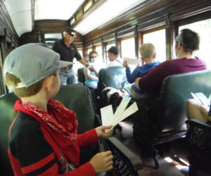 Passengers aboard the Wiscasset, Waterville and Farmington Railway. (Photo courtesy WW&F Railway Museum)