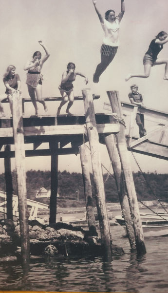 The much-used dock back in the 1970s. From left: Debbie Poland, Patty Ball, Susan Poland, Terry Leeman, Jill Russell, and Marshall Hanna. (Photo courtesy Lori Crook)