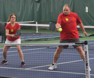 David Brooks backhands a shot while doubles partner Deborah Brooks looks on during the CLC YMCA Spring Fling Pickleball Tournament. (Mic LeBel photo)