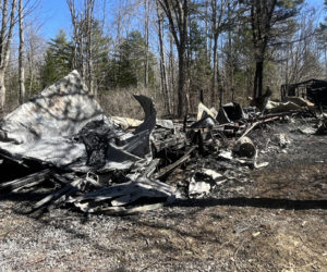 The remaining rubble from a structure fire that overtook a mobile home at 1248 Middle Road in Dresden in the early morning hours of Sunday, April 14. The Office of the Maine State Fire Marshal is investigating this fire, as well as a fire in Woolwich, as arson. (Piper Pavelich photo)