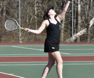 Olivia Crooker, of Lincoln Academy, serves the ball during preseason girls tennis action against Brunswick on Tuesday, April 9. (Mic LeBel photo)