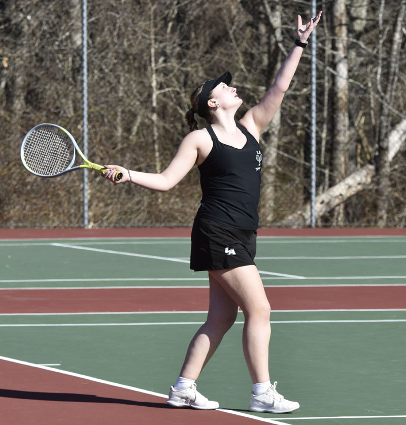 Olivia Crooker, of Lincoln Academy, serves the ball during preseason girls tennis action against Brunswick on Tuesday, April 9. (Mic LeBel photo)