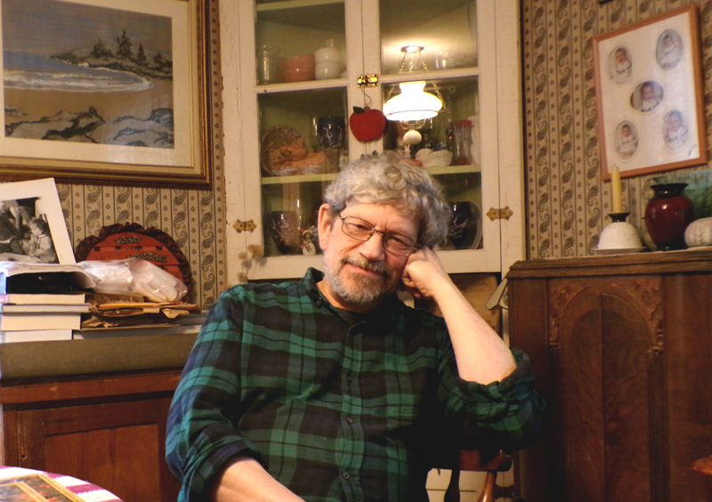 Van Reid at home in Edgecomb, the town he has spent most of his life getting to know. The Moosepath League saga, his series of novels detailing the adventures of a club of gentlemen across late-19th century Maine, drew on his background in a storytelling family and curiosity for history. (Elizabeth Walztoni photo)