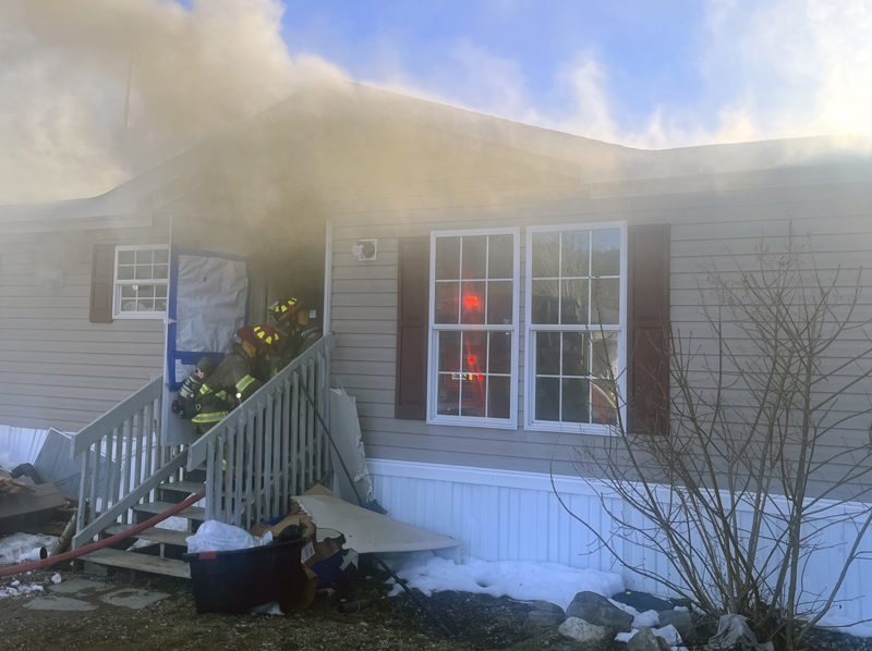 Nobleboro Fire and Rescue Lt.Kevin Rawley and firefighter Jon Corey prepare to make entry into the home at 412 East Pond Road the evening of Sunday, April 7. (Photo courtesy Nobleboro Fire and Rescue)