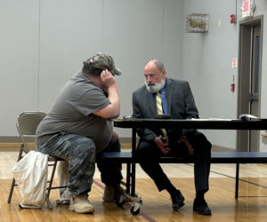 Former Somerville Planning Board Chair John Bergen (left) consults with lawyer John Hamer during his pre-termination hearing on Tuesday, April 9. (Molly Rains photo)