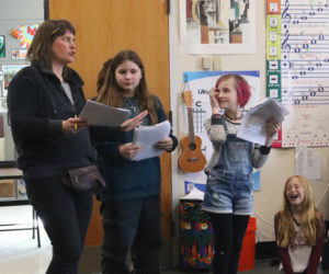 Whitefield Elementary School drama club advisor Elise Voigt (left) provides direction to students as they rehearse their play during a drama club meeting the afternoon of Tuesday, April 2. (Piper Pavelich photo)