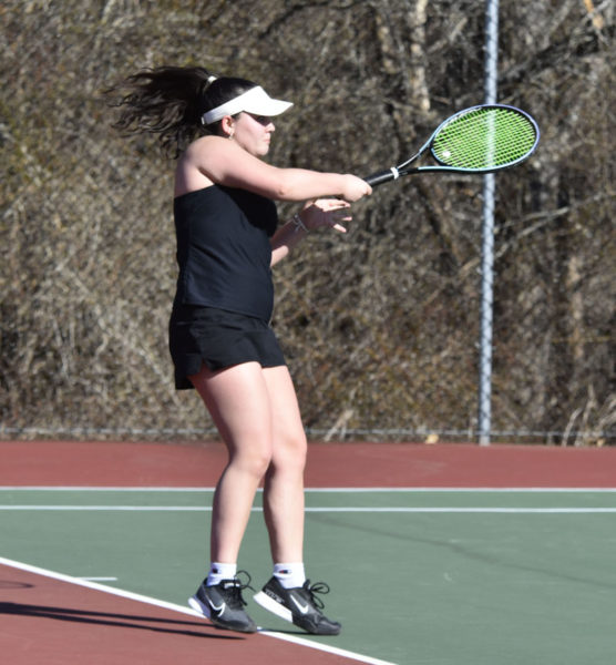 Olive Siegel smashes a return shot for the Eagles in preseason girls tennis action versus Brunswick on Tuesday, April 9. (Mic LeBel photo)