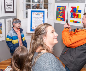 Wiscasset students show their delight at having their work exhibited at Maine Art Gallery. The Wiscasset K-12 student art show continues on the weekends of April 20-21 and April 27-28. (Photo courtesy Bob Bond)