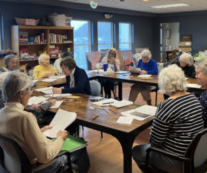 The Tidal River writers gather for a workshop. (Photo courtesy Merry Barn)