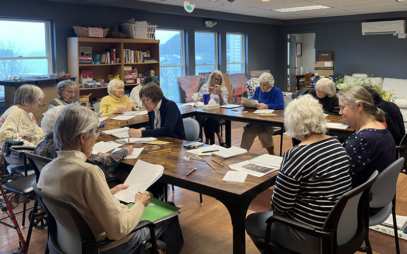 The Tidal River writers gather for a workshop. (Photo courtesy Merry Barn)