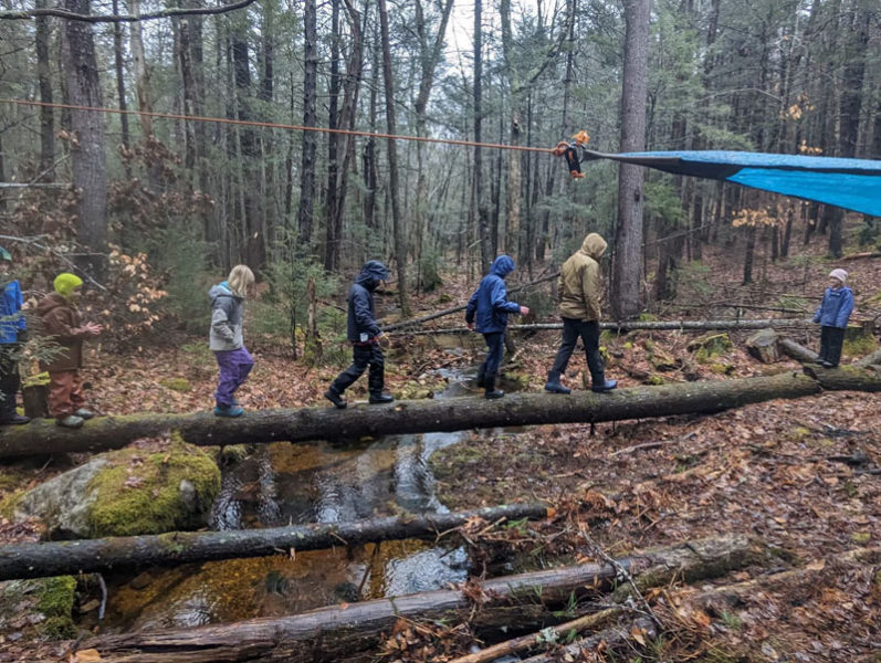 Hearty Roots campers walk through what is now the organization's new 114 acres of land in Bremen during an April vacation camp. According to Hearty Roots founder and Director Haley Bezon, the land was acquired formally on Wednesday, May 15, but the organization has been permitted to use it since September. (courtesy photo)