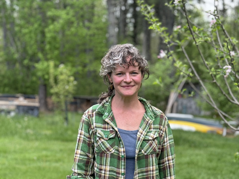 Christa Thorpe stands in the yard of her Bremen home on Thursday, May 23. Thorpe is a community development officer for Island Institute and a Bremen School Committee member who has worked in education and connecting communities all over the world. (Johnathan Riley photo)