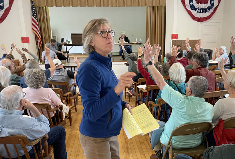 Ballot clerk Paula Swetland counts votes during Edgecomb's annual town meeting Saturday, May 18. Following an extended debate, residents narrowly agreed to create a full time fire chief position, voting with a show of hands, 33-31. (Sherwood Olin photo)