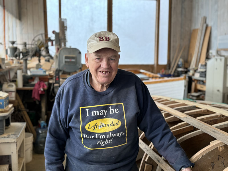 Cecil Burnham stands in his South Bristol boat shop, Shew and Burnham, on Thursday, May 9. Burnham retired from the position of South Bristols harbormaster in March, after 35 years of involvement with the towns harbor management. (Johnathan Riley photo)