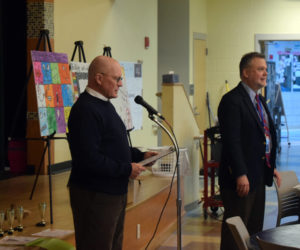 RSU 12 Board of Directors member Russell Gates (left) and district Superintendent Howard Tuttle address students and families at the district's anti-bullying poster contest awards dinner on Thurday, May 9. Gates is a founding member of the RSU 12 Anti-Bullying Committee, or ABC, which was founded in 2018. (Molly Rains photo)