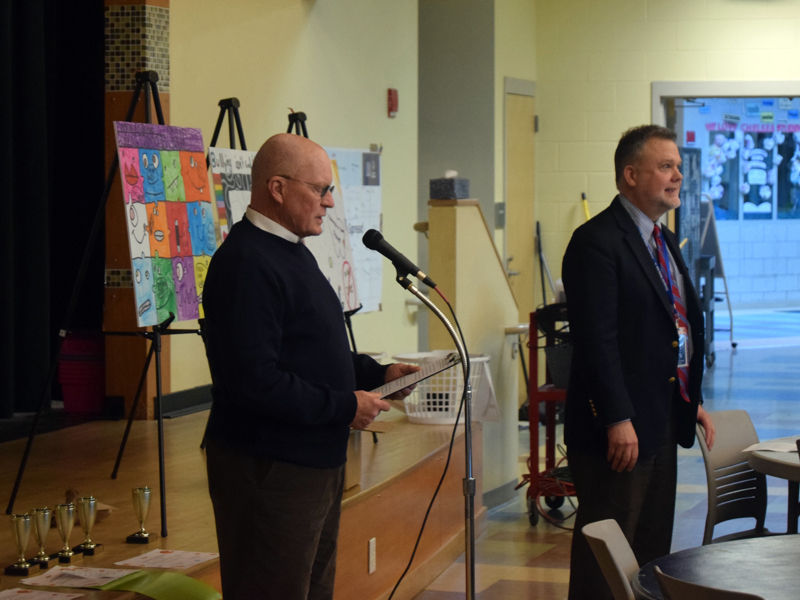 RSU 12 Board of Directors member Russell Gates (left) and district Superintendent Howard Tuttle address students and families at the district's anti-bullying poster contest awards dinner on Thurday, May 9. Gates is a founding member of the RSU 12 Anti-Bullying Committee, or ABC, which was founded in 2018. (Molly Rains photo)