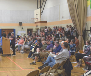 Miller School Principal Julia Levensaler, of Waldoboro, speaks to the RSU 40 Board of Directors about the districts transgender and gender expansive student policy in front of a packed gymnasium on the evening of Thursday, May 16. "Even at the elementary school I have needed to use this policy, and I was very glad that I didn't have to try and make it up on my own," Levensaler said. (Molly Rains photo)