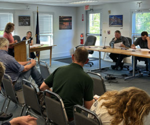 Waldoboro resident and farmer Haley Carmichael (left) speaks to the Waldoboro Select Board about a proposed food sovereignty ordinance on the evening of Tuesday, May 28. "For farms to thrive, we need to create a social, economic, and political landscape that values farming through grassroots organizing and advocacy," Carmichael said. (Molly Rains photo)