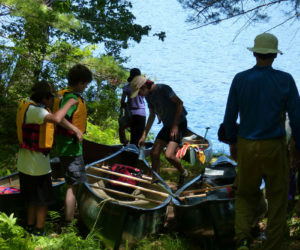 Visitors get ready to launch canoes on Little Dyer Pond. (Photo courtesy Midcoast Conservancy)