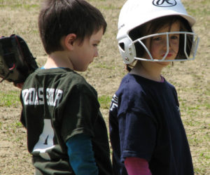 Cash Whitney plays third base for Midcoast Solar while Maisey Wotton runs the bases for Wotton's Lobster Wharf during an afternoon T-ball game at the Pemaquid Beach baseball field on Sunday, May 12. (Courtesy photo)