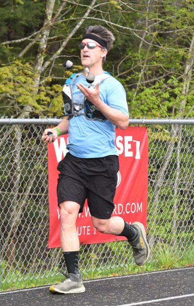 Jason Bigonia, of South Bristol, set a world record by "joggling," or jogging while juggling, for 50 km in a time of 4:33. He fell just 15 minutes short of the slighly longer 50-mile record. (Mic LeBel photo)