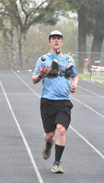 Jason Bigonia, of South Bristol, fundraises for Grahamtastic Connection as he juggled and jogged - known as "joggling" - 50 miles in an attempt to break a world record on Sunday, May 19 in Wiscasset. (Mic LeBel photo)