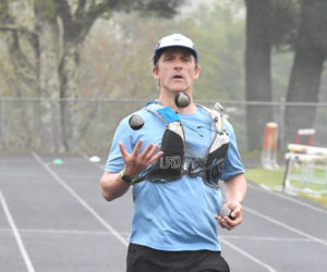 Jason Bigonia, of South Bristol, fundraises for Grahamtastic Connection as he juggled and jogged - known as "joggling" - 50 miles in an attempt to break a world record on Sunday, May 19 in Wiscasset. (Mic LeBel photo)