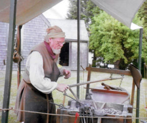 Jeffrey Miller works at his temporary forge during a blacksmith demonstration at the 1754 Chapman-Hall House in Damariscotta. (Photo courtesy Lincoln County Historical Association)