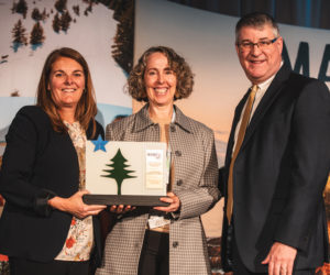 Maine Department of Economic and Community Development Commissioner Heather Johnson (left) and Maine Office of Tourism Director Steve Lyons present the Governors Award for Tourism Excellence to Coastal Maine Botanical Gardens President and CEO Gretchen Ostherr, and (Photo courtesy Coastla Maine Botanical Gardens)