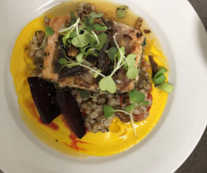 The prize-winning dish in the Local Food Challenge was seared salmon over a barley risotto and a maple carrot puree with a honey garlic sauce and garnished with fried parsnips and charred leeks, prepared by Lincoln Academy and Bath Tech students Eleanor Nery and Gwen Weaver. (Photo courtesy Lincoln Academy)