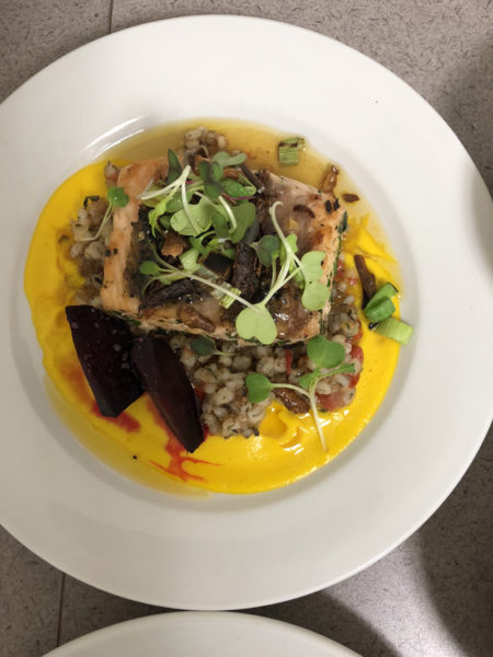 The prize-winning dish in the Local Food Challenge was seared salmon over a barley risotto and a maple carrot puree with a honey garlic sauce and garnished with fried parsnips and charred leeks, prepared by Lincoln Academy and Bath Tech students Eleanor Nery and Gwen Weaver. (Photo courtesy Lincoln Academy)