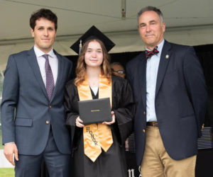 At her Lincoln Academy graduation, Bath Regional Career and Technical Center Career and Technical Student of the Year Eleanor Nery is flanked by her academic advisor Angus Fake (left) and LA Head of School Jeff Burroughs.