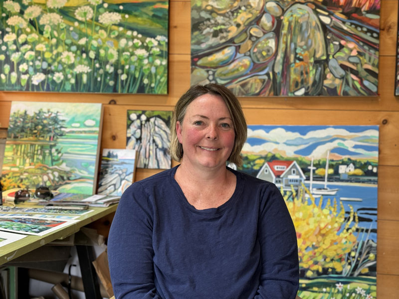 Painter and muralist Susan Bartlett Rice sits in her art studio at her South Bristol home on Thursday, June 6. Rice has been artistically inclined for as long as she can remember. The Lincoln Academy graduates murals are all over the New England coast and every fall, she paints a giant pumpkin for Damariscottas Pumpkinfest and Regatta. (Johnathan Riley photo)