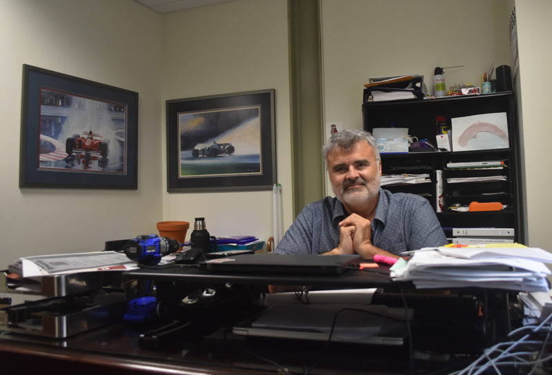 Matthew Graff, executive director of Skidompha Public Library in Damariscotta, sits in his office. "I want to do better by our patrons. But at this moment, because of this situation, we're not able to," Graff said on Friday, June 21, referring to an interruption to interlibrary lending services that will affect libraries across Maine this summer. (Molly Rains photo)