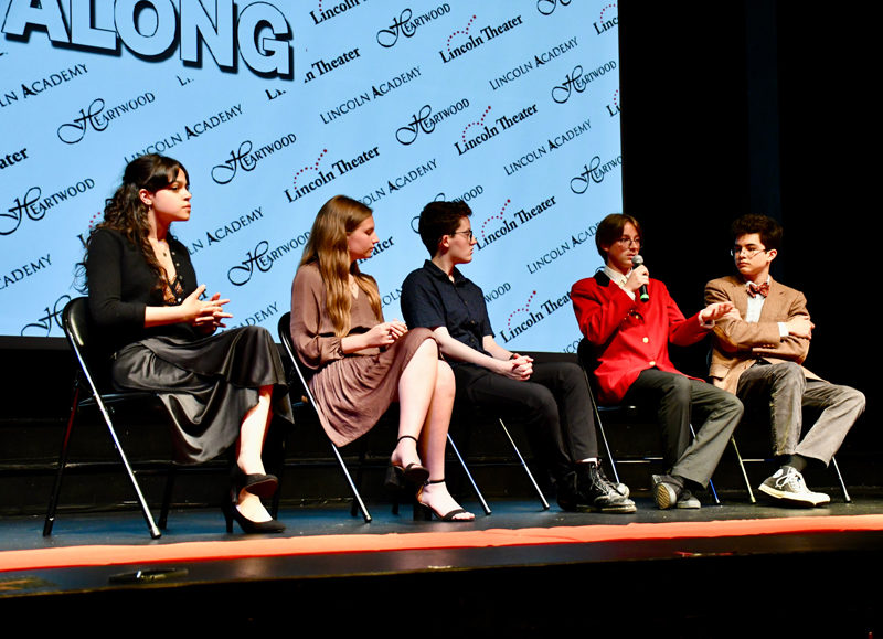 Cast and production members Sophia Scott, Kayla Cruz, Annalise Garnett, and Elias Bassett listen as Eli Melanson answers a question during the Q&A session after the premiere of Getting Along at the Lincoln Theater on Monday, June 10. The film was a collaboration between Lincoln Academy students, Heartwood Theater, and David Martinez, of Maine Media. (Dylan Burmeister photo)