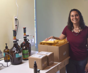 Stephanie Cheney, owner of Flick the Tick and Soothing Lotion, stands in the Newcastle production space where she and her family produce their outdoor skincare products. (Molly Rains photo)