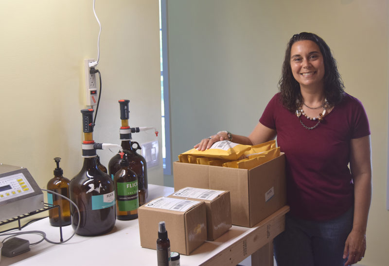 Stephanie Cheney, owner of Flick the Tick and Soothing Lotion, stands in the Newcastle production space where she and her family produce their outdoor skincare products. (Molly Rains photo)