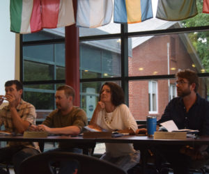 From left: Newcastle Select Board members Rufus Percy, Thomas Kostenbader, Karen Leavitt Paz, and Joel Lind speak to residents at the Monday, June 17 annual town meeting at Lincoln Academy. (Nolan Wilkinson photo).