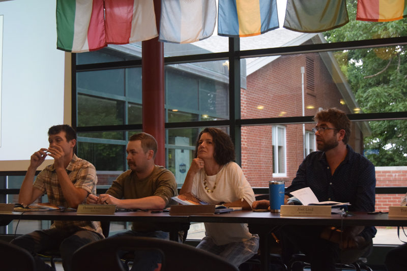 From left: Newcastle Select Board members Rufus Percy, Thomas Kostenbader, Karen Leavitt Paz, and Joel Lind speak to residents at the Monday, June 17 annual town meeting at Lincoln Academy. (Nolan Wilkinson photo).