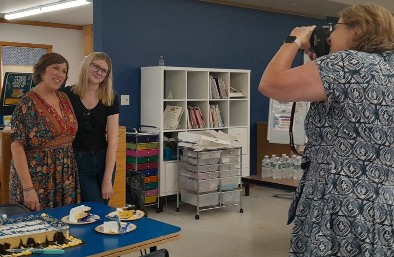 Midcoast Adult & Community Education Director Rachelle Leonard (right) takes a photo of Program Assistant Betty Cheff (left) and Nancy Thibodeau at the program's graduation at the Medomak Valley High School library on Thursday, June 13. (Nolan Wilkinson photo)