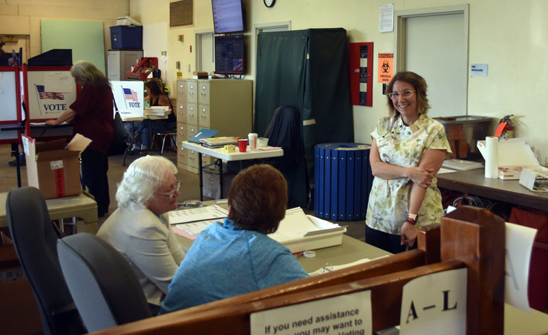 From left: Ballot clerks Delia Mohlie and Wanda Collamore prepare to welcome Waldoboro voters to the polls on June 11 as Town Clerk Pamela Jameson looks on. (Molly Rains photo)