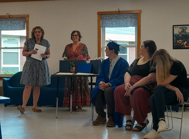 From left: Midcoast Adult & Community Education Director Rachelle Leonard, Program Assistant Betty Cheff, and Zachary Perkins, Lillian Wellman, and Nancy Thibodeau participate in the program's graduation ceremony in the Medomak Valley High School library on Thursday, June 13. (Nolan Wilkinson photo)
