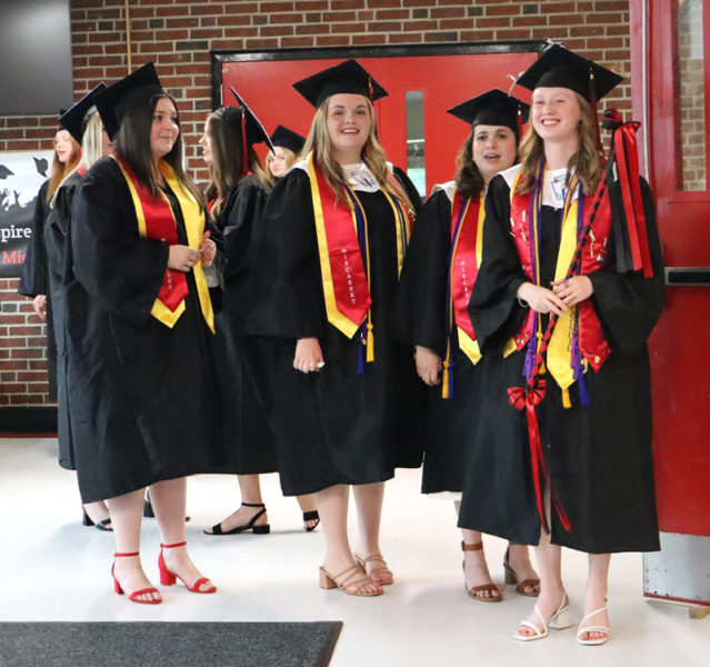 From left: Kaitlyn Talbert, Linnea Andersson, Grace Greene, and Emily Gilliam prepare to enter the Wiscasset Middle High School gym for the class of 2024's commencement ceremony the evening of Thursday, June 6. (Piper Pavelich photo)